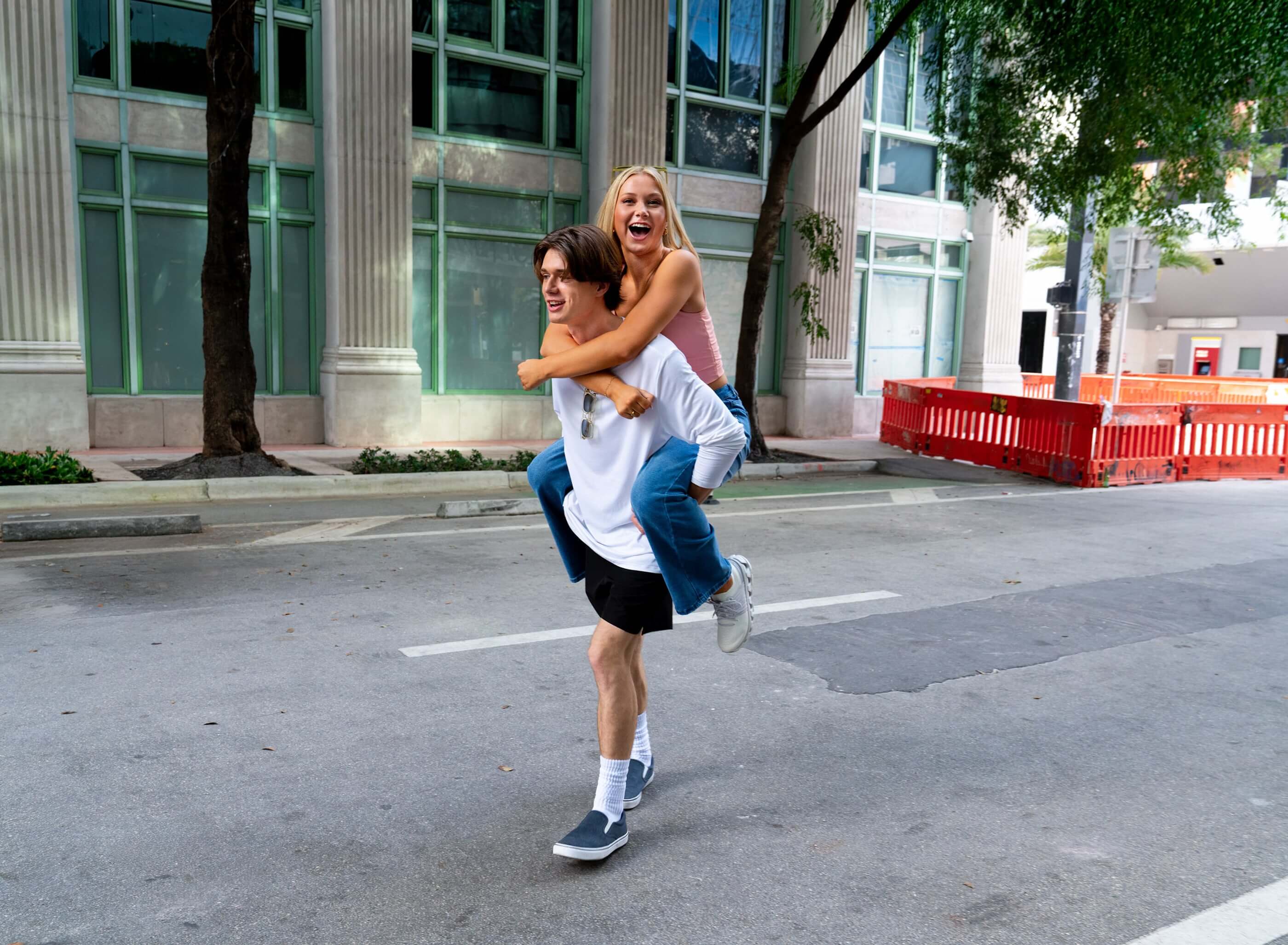 young woman piggybacking off boyfriend