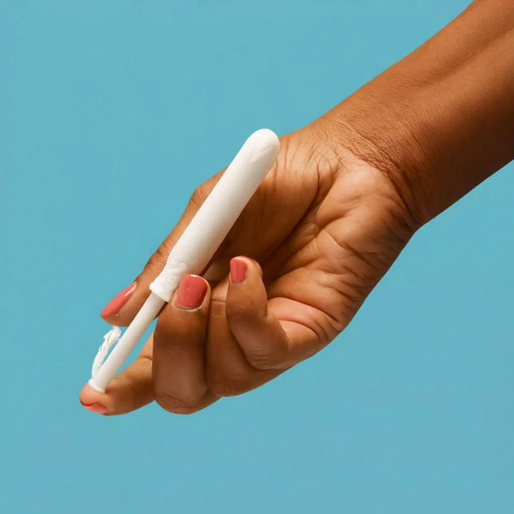 Hand holding a tampon